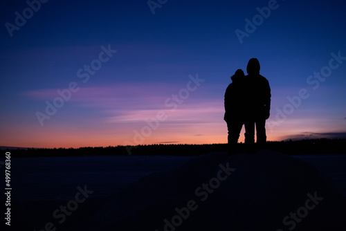 Couple watching a colorful sunset