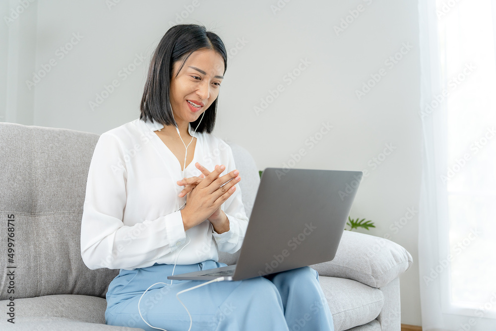Online job interview. Asian businesswoman is being interviewed for a job with an executive via video call. Talk about past work experience and competence in the position. resume or personal record Online job interview. Asian businesswoman is being interviewed for a job with an executive via video call. Talk about past work experience and competence in the position. resume or personal record