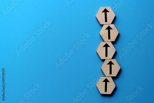 Chain of blocks of unidirectional arrows with copy space. Consistency, focus, moving forward. photo