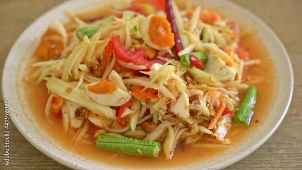 Som Tum - Thai Spicy green papaya salad with salty eggs - Asian food style Som Tum - Thai Spicy green papaya salad with salty eggs - Asian food style
