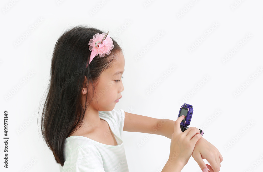 Little Asian girl kid using smart watch video camera against white background Little Asian girl kid using smart watch video camera against white background