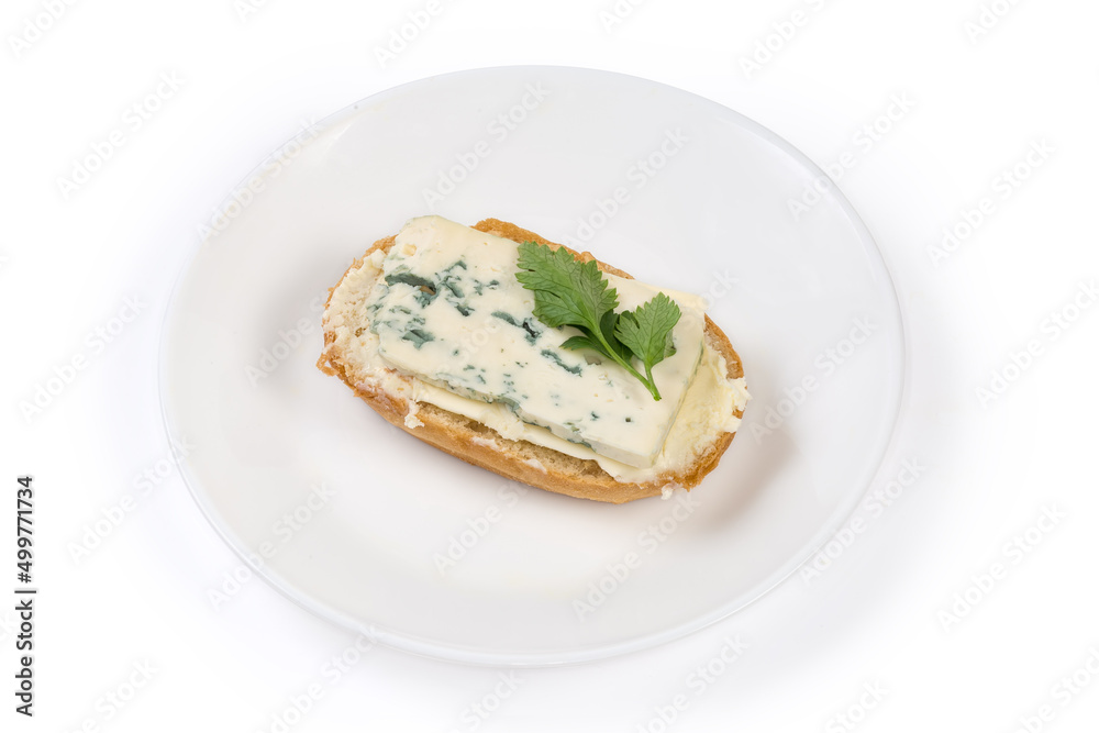 Open sandwich with butter and blue cheese on a dish