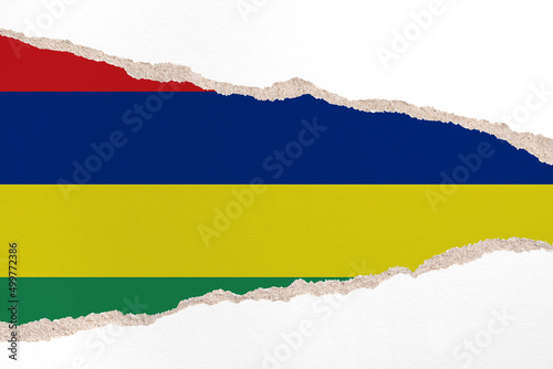 Ripped paper background in colors of national flag. Mauritius