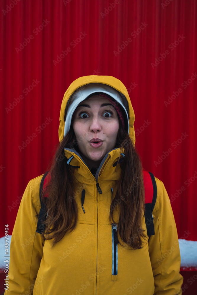 woman facial expression with red background