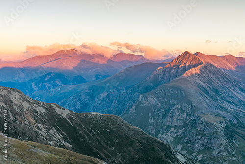 Golden light at sunrise in the mountains (Peak of Puigmal, Pyrenees Mountains)
