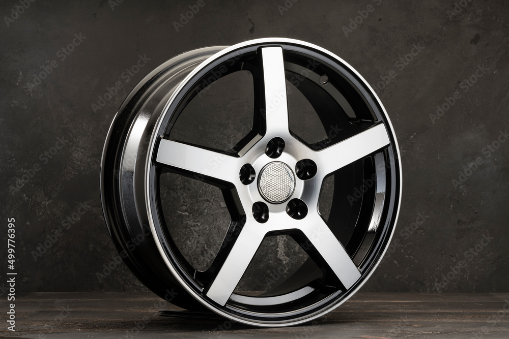 new fashionable sports alloy wheels for cars close-up on a black background.