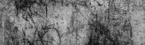 Black and white stone wall texture, dark black grunge background. Horror Cement texture, wall full of scratches, Scary dark wall, grungy cement.