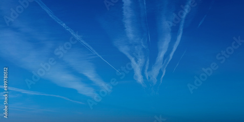 Canvas Print Airplane contrail against blue sky