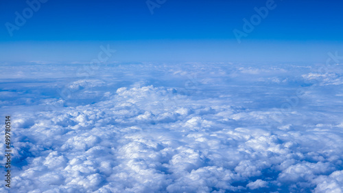 Beautiful cloudscape with blue sky. Wonderful panorama above white clouds