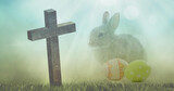 Image of wooden cross falling over bunny