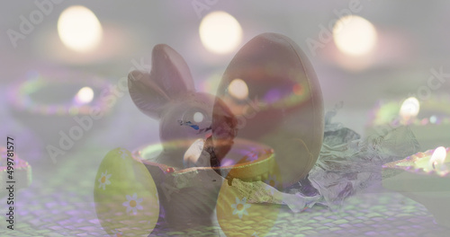 Image of eggs and lights falling over bunny