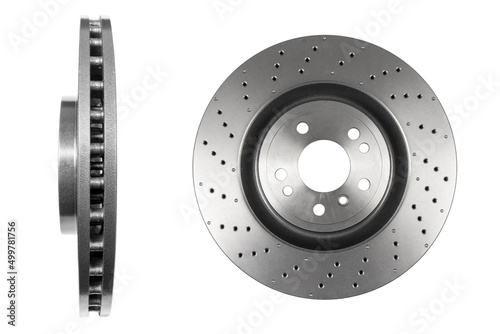 Car brake disc isolated on white background. Auto spare parts. Perforated brake disc rotor isolated on white. Braking ventilated discs. Quality spare parts for car service or maintenance photo