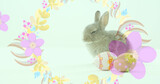 Image of easter eggs and easter bunny with spinning flowers on green background