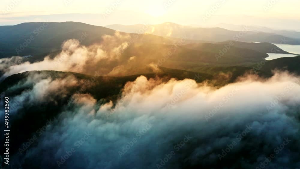 Sunset and fog over the cape of four rocks. Sights of Primorsky Krai, Russia.