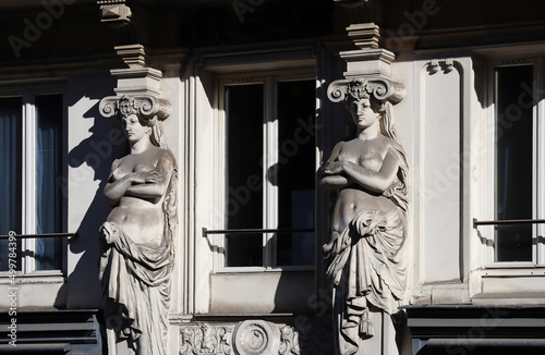 Caryatids on the facade of a 19th century building in the 6th arrondissement of Paris