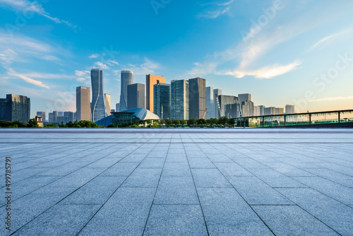 Empty square floor and city skyline with modern commercial buildings in Hangzhou at sunrise, China Fototapeta