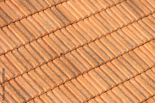 The texture of clay tiles on the roof. Building materials background.