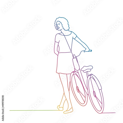 Young woman going near bike.