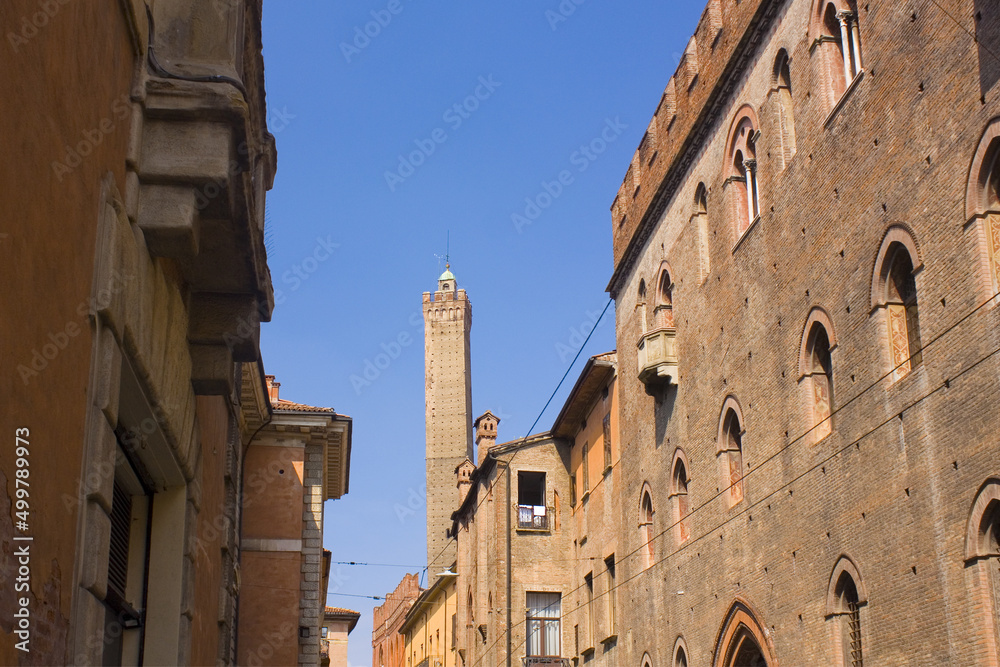 View of medieval Asinelli Tower from street of Old Town in Bologna, Italy
