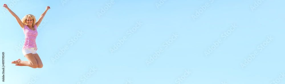 Panorama Web Banner Header Young Woman Jumping in Blue Sky Panorama Web Banner Header Young Woman Jumping in Blue Sky