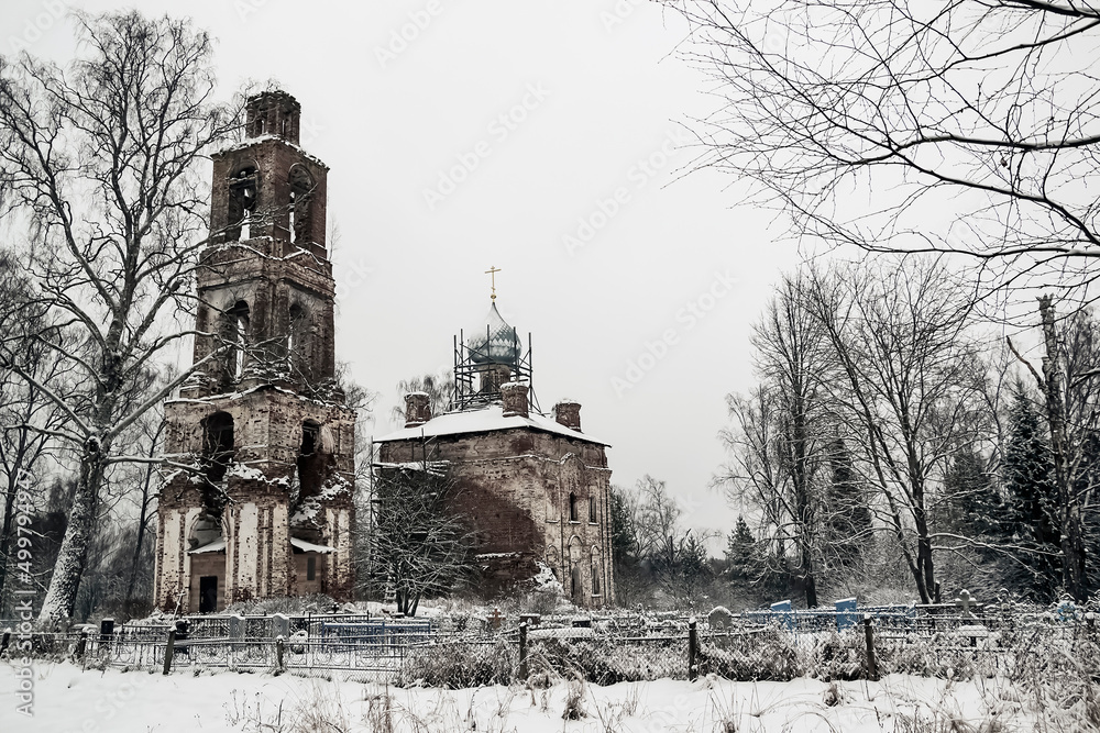 destroyed Church in the cemetery in winter