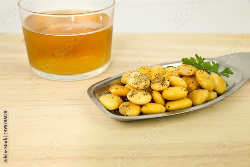 Spanish Tapa of Lupin Beans next to cold beer