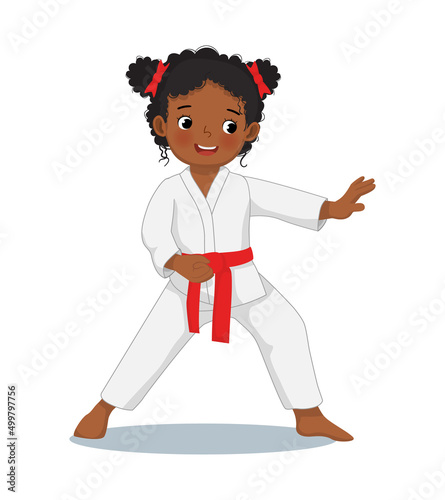 cute little karate kid African girl with red belt showing hand defense techniques poses in martial art training practice
