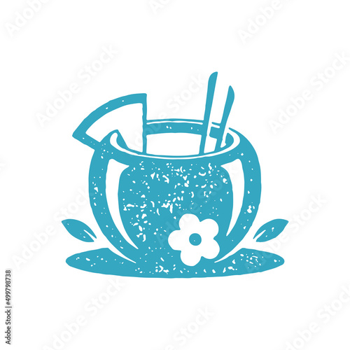 Cute summer cocktail in coconut with fruit slice and straw decorated by tenderness flower