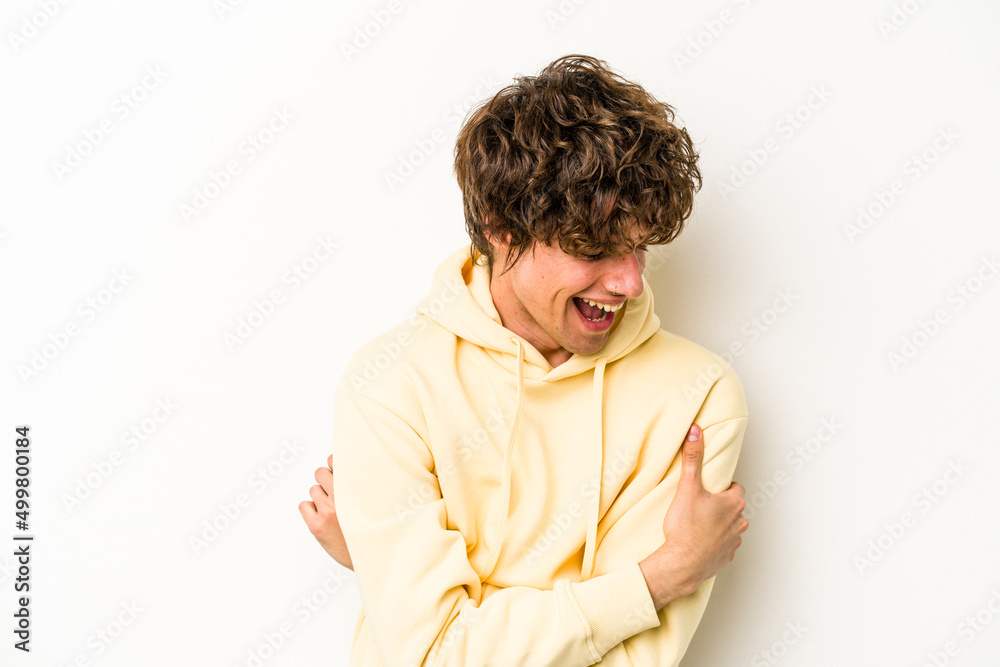 Young caucasian man isolated on white background laughing and having fun. Young caucasian man isolated on white background laughing and having fun.