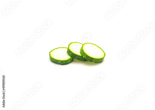 Close-up three sliced luffa (smooth sponge loofah) fruit cutouts isolated on white background photo