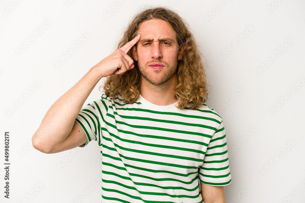 Young caucasian man isolated on white background pointing temple with finger, thinking, focused on a task. Young caucasian man isolated on white background pointing temple with finger, thinking, focused on a task.
