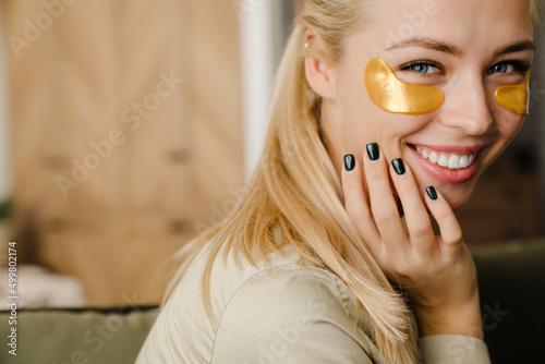 Fotobehang Blonde white woman with eye patches smiling at camera