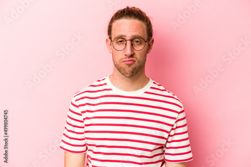 Wallpaper Mural Young caucasian man isolated on pink background sad, serious face, feeling miserable and displeased. Torontodigital.ca