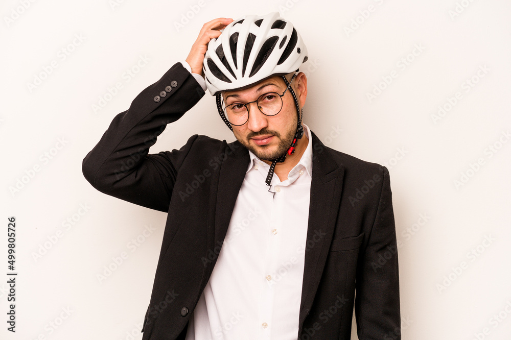 Business hispanic man wearing a helmet bike isolated on white background being shocked, she has remembered important meeting. Business hispanic man wearing a helmet bike isolated on white background being shocked, she has remembered important meeting.