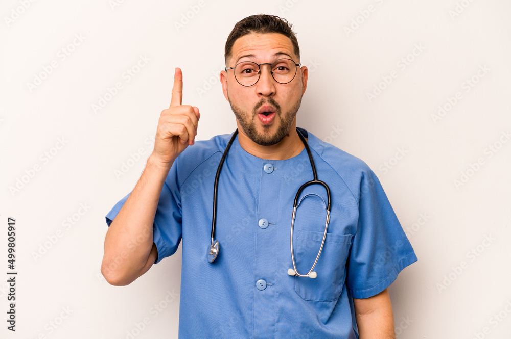 Hispanic nurse man isolated on white background having some great idea, concept of creativity. Hispanic nurse man isolated on white background having some great idea, concept of creativity.