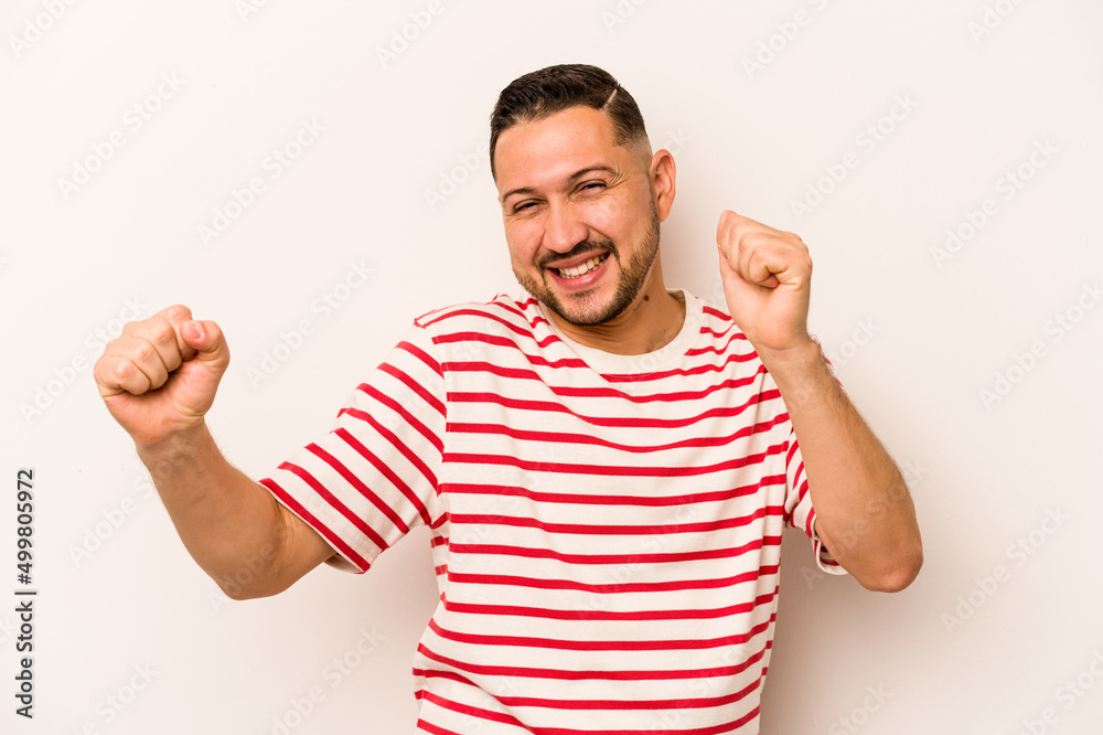 Young hispanic man isolated on white background dancing and having fun. Young hispanic man isolated on white background dancing and having fun.