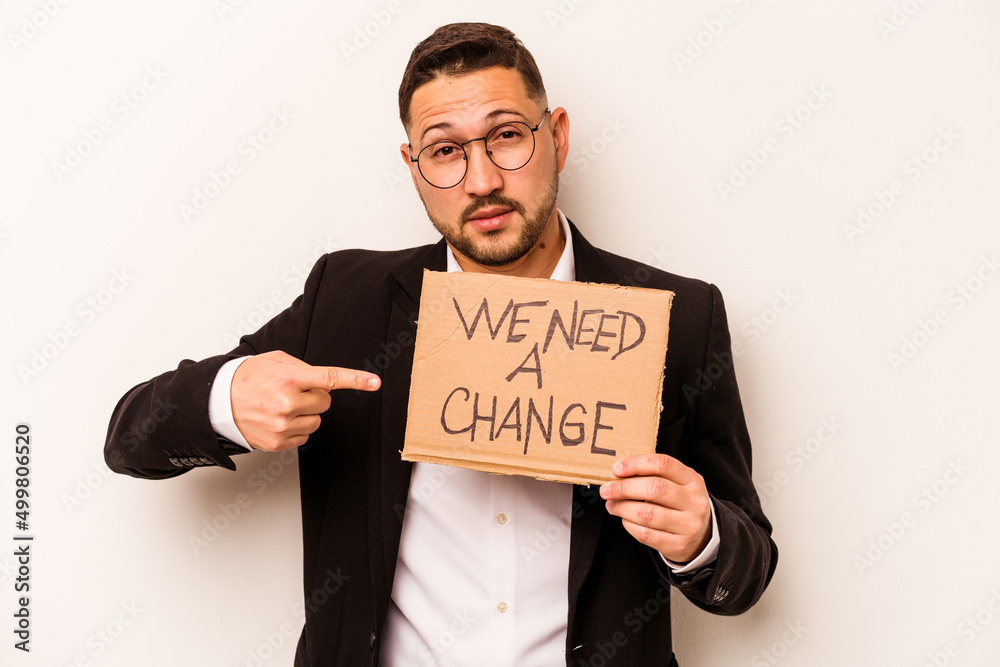 Hispanic business man holding wee need a change placard isolated on white background Hispanic business man holding wee need a change placard isolated on white background