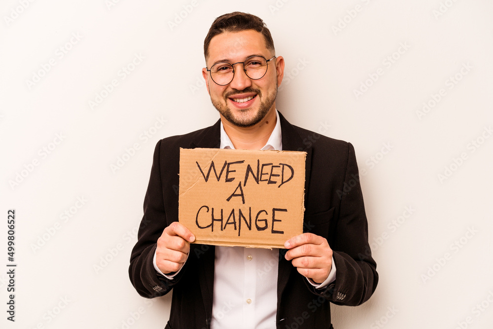 Hispanic business man holding wee need a change placard isolated on white background Hispanic business man holding wee need a change placard isolated on white background