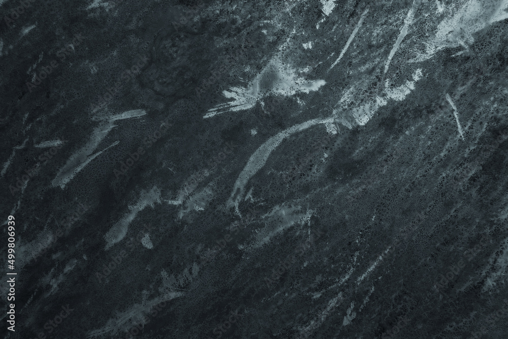 Fototapeta premium Dark worn backdrop with grunge stained texture