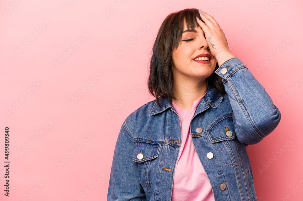 Young caucasian woman isolated on pink background laughing happy, carefree, natural emotion. Young caucasian woman isolated on pink background laughing happy, carefree, natural emotion.
