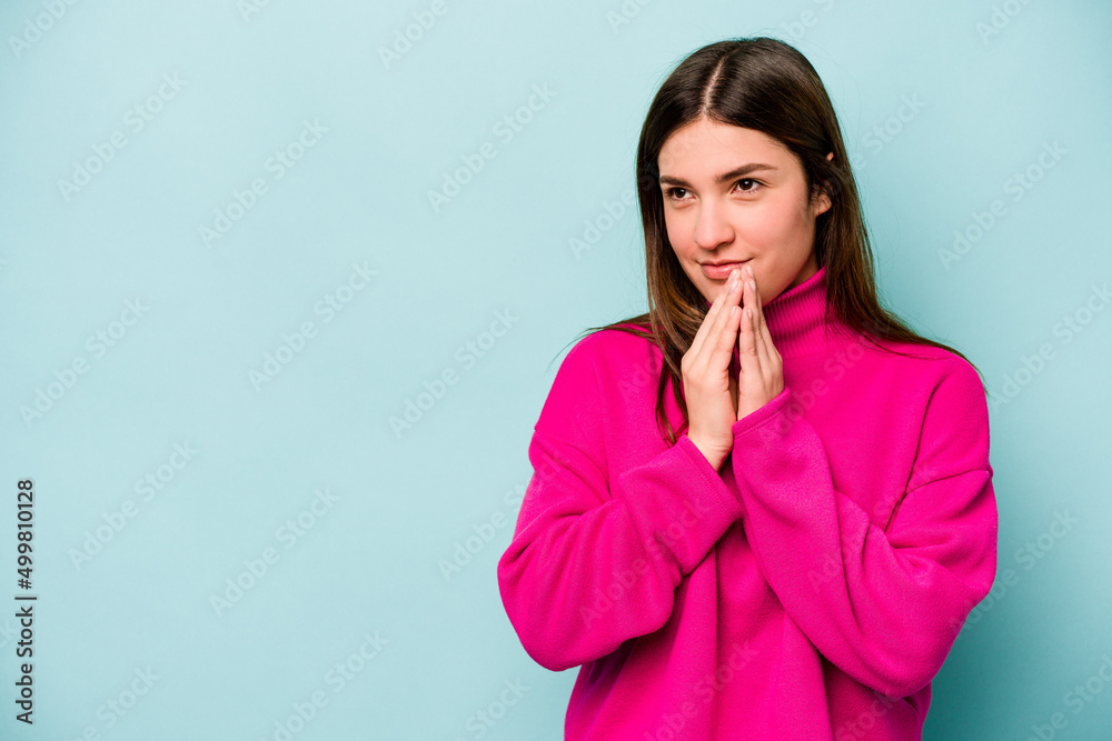 Young caucasian woman isolated on blue background making up plan in mind, setting up an idea. Young caucasian woman isolated on blue background making up plan in mind, setting up an idea.