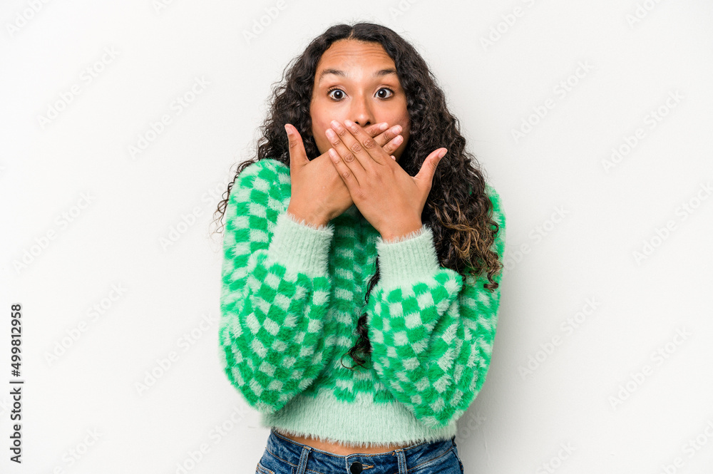 Young hispanic woman isolated on white background shocked covering mouth with hands. Young hispanic woman isolated on white background shocked covering mouth with hands.