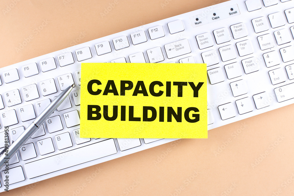 Text CAPACITY BUILDING text on a sticky on keyboard, business concept Text CAPACITY BUILDING text on a sticky on keyboard, business concept