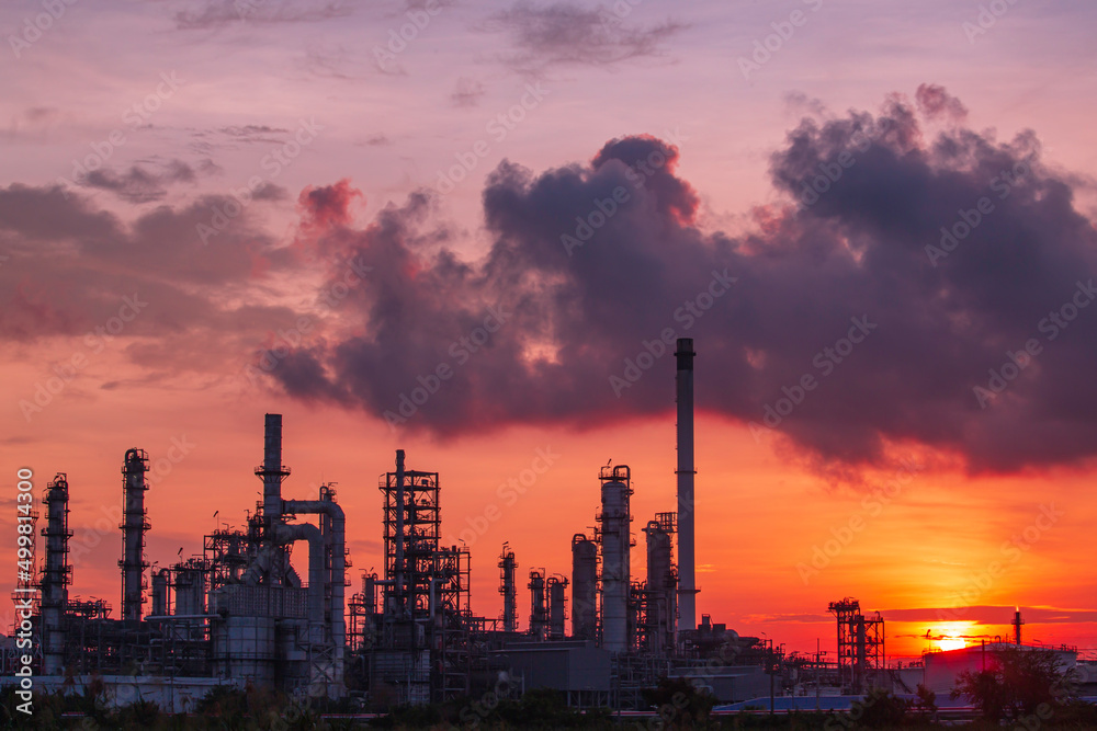 Oil​ refinery​ and​  plant and tower column of Petrochemistry industry in pipeline oil​ and​ gas​ ​industrial with​ cloud​ slowing red sky