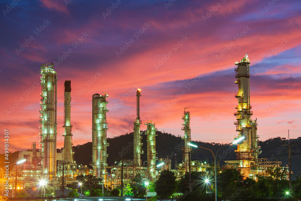 Oil​ refinery​ and​ plant and tower column of Petrochemistry industry in oil​ and​ gas​ ​industrial with​ cloud​ red​ ​sky the evening​ sunset