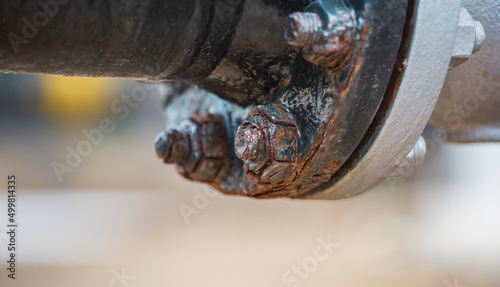 Rust damage paint and corrosion flange and bolt nut on pipeline photo