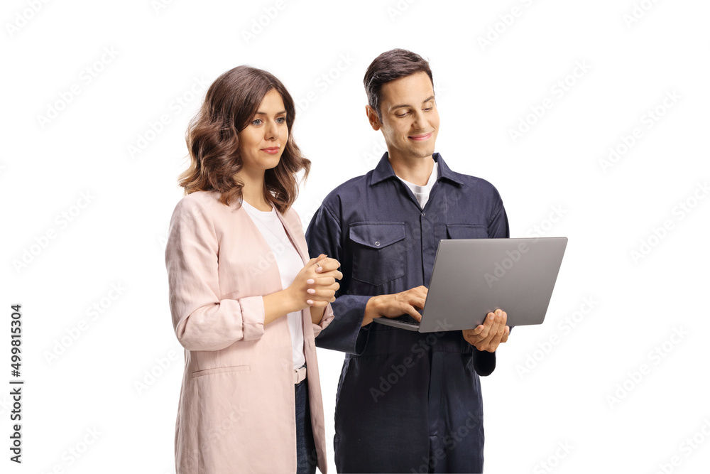 Young woman looking at a laptop computer with a male worker in a uniform Young woman looking at a laptop computer with a male worker in a uniform