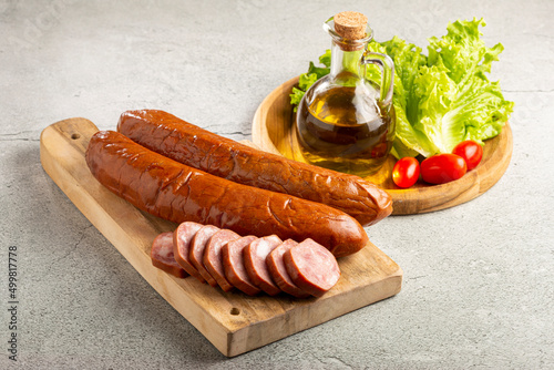 Raw smoked sausage on the table. Calabrese sausage.