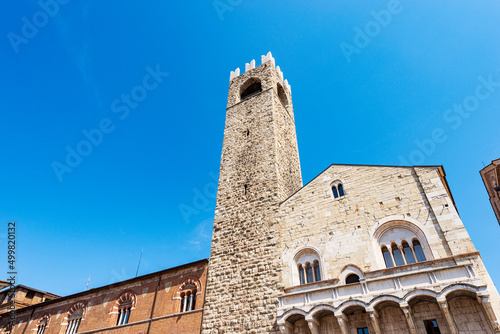 Brescia. Medieval Broletto Palace (Palazzo Broletto), XII-XXI century, with the ancient tower (Torre del Popolo o del Pegol) and the Loggia of Cries (Loggia delle Grida). Lombardy, Italy, Europe. photo