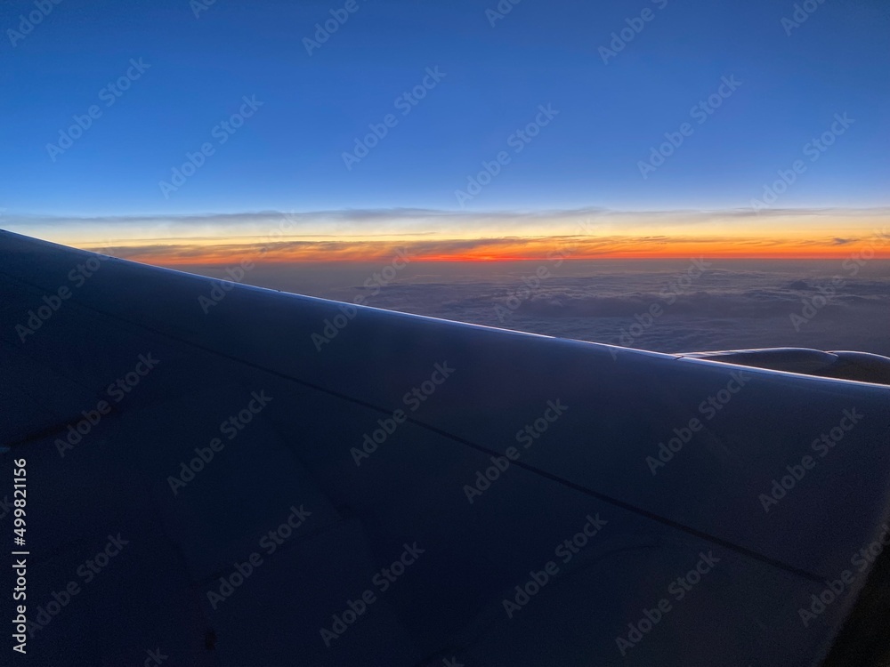view from airplane on the red sunrise.